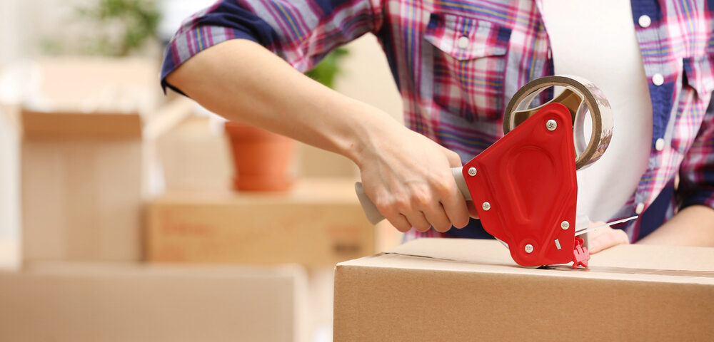 Woman packing up boxes from her dad's home