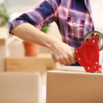 Woman packing up boxes from her dad's home