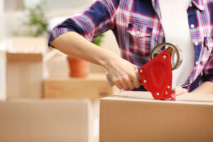 Woman packing up boxes from her dad's home