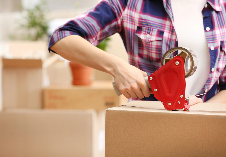 Woman packing up boxes from her dad's home